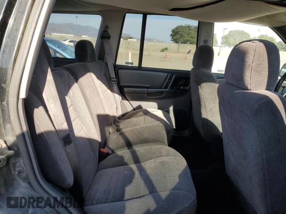 ✅ 1998 Jeep Grand Cherokee Laredo • VIN: 1J4FX58S6WC294787 • Лот: 71563695. Опубликован ранее на Copart с пробегом 198 537 миль. Бесплатный доступ к архиву аукционных продаж из США и подробный отчёт об истории автомобиля на DreamBid. Изображение 11.