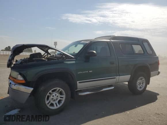 2001 Dodge Dakota Sport z VIN 1B7GG26N81S262671, wystawiony jako Copart lot #71080995 z przebiegiem 145 480 mil mil oraz Szkoda całkowita • Salvage title. Historia ofert i sprzedaży dostępna na DreamBid. Obrazek 1.