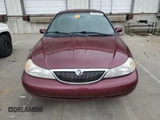 ✅ 1999 Mercury Mystique • VIN: 1MEFM66L4XK617806 • Лот: 69687625. Опубликован ранее на Copart с пробегом 84 409 миль. Бесплатный доступ к архиву аукционных продаж из США и подробный отчёт об истории автомобиля на DreamBid. Изображение 5.