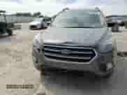2018 Ford Escape SE z VIN 1FMCU9GD6JUD48647, wystawiony jako Copart lot #70868345 z przebiegiem 102 072 mil mil oraz Szkoda całkowita • Salvage title. Historia ofert i sprzedaży dostępna na DreamBid. Obrazek 14.