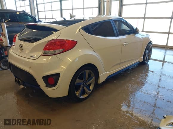 ✅ 2013 Hyundai Veloster Turbo • VIN: KMHTC6AE8DU085262 • Lot: 41607267. Listed on IAAI with 200,159 mi. Free auction sales archive from the USA and detailed vehicle history report at DreamBid. Image 4.