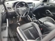 ✅ 2013 Hyundai Veloster Turbo • VIN: KMHTC6AE0DU127584 • Lot: 61375525. Listed on Copart with 128,913 mi. Free auction sales archive from the USA and detailed vehicle history report at DreamBid. Image 8.