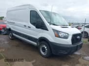 ✅ 2023 Ford Transit Cargo • VIN: 1FTBR1C8XPKC07063 • Lot: 42103484. Listed on IAAI with 12,946 mi. Free auction sales archive from the USA and detailed vehicle history report at DreamBid. Image 1.