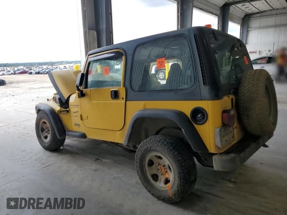 ✅ 2000 Jeep Wrangler Sport • VIN: 1J4FA49S5YP739381 • Лот: 81209995. Опубликован ранее на Copart с пробегом 286 678 миль. Бесплатный доступ к архиву аукционных продаж из США и подробный отчёт об истории автомобиля на DreamBid. Изображение 2.
