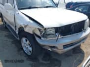 ✅ 2003 Toyota Land Cruiser • VIN: JTEHT05J732046635 • Lot: 42999962. Listed on IAAI with 263,143 mi. Free auction sales archive from the USA and detailed vehicle history report at DreamBid. Image 6.