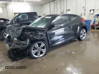 2014 Hyundai Veloster z VIN KMHTC6AD2EU208868, wystawiony jako Copart lot #65717864 z przebiegiem 150 225 mil mil oraz Szkoda całkowita • Salvage title. Historia ofert i sprzedaży dostępna na DreamBid. Obrazek 1.