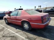 ✅ 2000 Cadillac Eldorado • VIN: 1G6EL12Y2YU151886 • Lot: 65156625. Wystawiony na Copart z przebiegiem 81 430 mil. Bezpłatny archiwum sprzedaży aukcyjnych z USA i szczegółowy raport historii pojazdu na DreamBid. Zdjęcie 2.