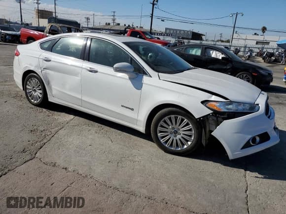✅ 2016 Ford Fusion SE Hybrid • VIN: 3FA6P0LU9GR157112 • Lot: 80173065. Listed on Copart with 84,969 mi. Free auction sales archive from the USA and detailed vehicle history report at DreamBid. Image 4.