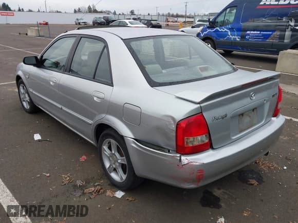 ✅ 2003 Mazda Protege DX • VIN: JM1BJ225330217847 • Лот: 43838287. Опубликован ранее на IAAI с пробегом 276 700 миль. Бесплатный доступ к архиву аукционных продаж из США и подробный отчёт об истории автомобиля на DreamBid. Изображение 3.