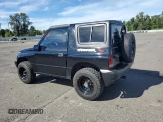 ✅ 1998 Chevrolet Tracker • VIN: 2CNBJ1868W6925819 • Лот: 70881874. Опубликован ранее на Copart с пробегом 180 849 миль. Бесплатный доступ к архиву аукционных продаж из США и подробный отчёт об истории автомобиля на DreamBid. Изображение 2.