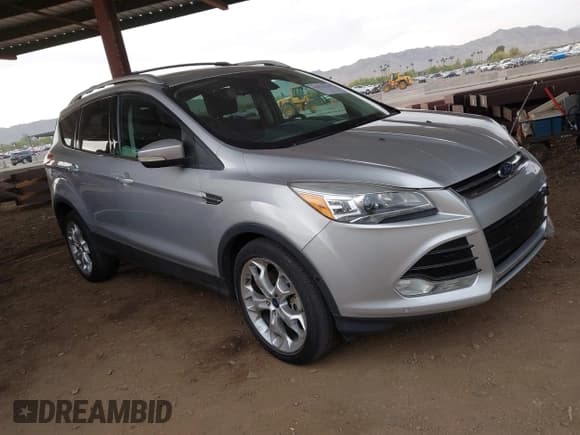 ✅ 2013 Ford Escape Titanium • VIN: 1FMCU0J92DUB64035 • Lot: 42023748. Listed on IAAI with 177,636 mi. Free auction sales archive from the USA and detailed vehicle history report at DreamBid. Image 1.