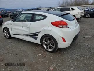 ✅ 2013 Hyundai Veloster w/Gray Int • VIN: KMHTC6AD9DU123900 • Lot: 79906394. Wystawiony na Copart z przebiegiem 103 950 mil. Bezpłatny archiwum sprzedaży aukcyjnych z USA i szczegółowy raport historii pojazdu na DreamBid. Zdjęcie 2.