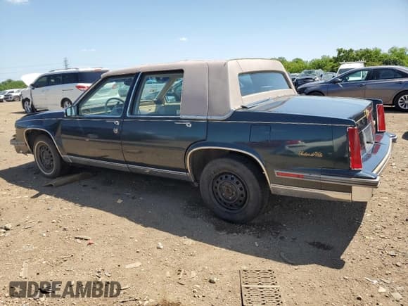 ✅ 1987 Cadillac DeVille • VIN: 1G6CD5180H4239140 • Lot: 61236165. Listed on Copart with 36,668 mi. Free auction sales archive from the USA and detailed vehicle history report at DreamBid. Image 2.