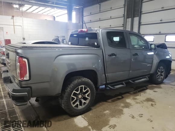 ✅ 2021 GMC Canyon 4WD AT4 • VIN: 1GTG6FEN1M1203936 • Лот: 56041315. Опубликован ранее на Copart с пробегом 54 939 миль. Бесплатный доступ к архиву аукционных продаж из США и подробный отчёт об истории автомобиля на DreamBid. Изображение 3.
