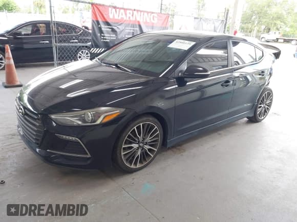 ✅ 2018 Hyundai Elantra Sport • VIN: KMHD04LB1JU481274 • Lot: 42800159. Listed on IAAI with 130,934 mi. Free auction sales archive from the USA and detailed vehicle history report at DreamBid. Image 2.