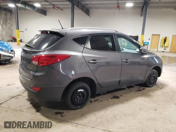 2015 Hyundai Tucson SE z VIN KM8JU3AG1FU973407, wystawiony jako Copart lot #59017604 z przebiegiem Nie podano mil oraz Szkoda całkowita • Salvage title. Historia ofert i sprzedaży dostępna na DreamBid. Obrazek 3.