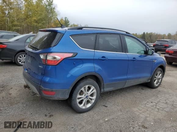 2018 Ford Escape SE z VIN 1FMCU9GD7JUA05961, wystawiony jako Copart lot #82458805 z przebiegiem Nie podano mil oraz Czysty tytuł • Clean title. Historia ofert i sprzedaży dostępna na DreamBid. Obrazek 3.