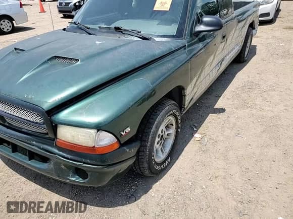 1999 Dodge Dakota SLT z VIN 1B7GL22X0XS145128, wystawiony jako Copart lot #64959364 z przebiegiem 96 047 mil mil oraz Szkoda całkowita • Salvage title. Historia ofert i sprzedaży dostępna na DreamBid. Obrazek 11.