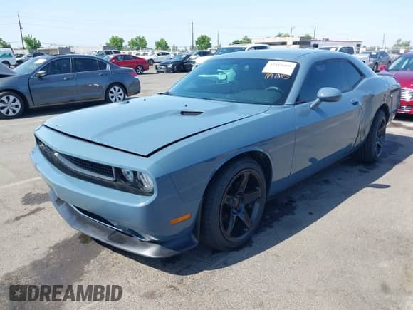 2014 Dodge Challenger SXT 100th Anniversary z VIN 2C3CDYAG1EH289991, wystawiony jako IAAI lot #42419468 z przebiegiem 164 799 mil mil oraz . Historia ofert i sprzedaży dostępna na DreamBid. Obrazek 2.
