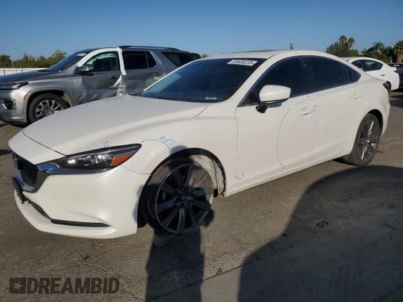 ✅ 2021 Mazda 6 Touring • VIN: JM1GL1VM0M1611282 • Лот: 85930235. Опубликован ранее на Copart с пробегом 124 447 миль. Бесплатный доступ к архиву аукционных продаж из США и подробный отчёт об истории автомобиля на DreamBid. Изображение 1.