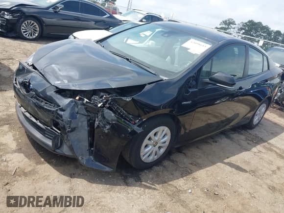 ✅ 2022 Toyota Prius L Eco • VIN: JTDKAMFU8N3181135 • Lot: 42098611. Listed on IAAI with 69,949 mi. Free auction sales archive from the USA and detailed vehicle history report at DreamBid. Image 2.