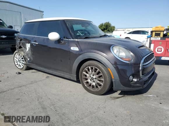 2014 MINI Hardtop S with VIN WMWXM7C59ET987820, listed as a Copart auction lot 59164955 with 77,699 mi miles and Salvage title. Bid and sale history available at DreamBid. Image 4.