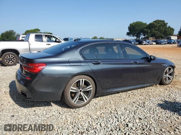 ✅ 2016 BMW 7 Series 750i • VIN: WBA7F0C57GGM20857 • Lot: 61143845. Listed on Copart with 141,313 mi. Free auction sales archive from the USA and detailed vehicle history report at DreamBid. Image 3.