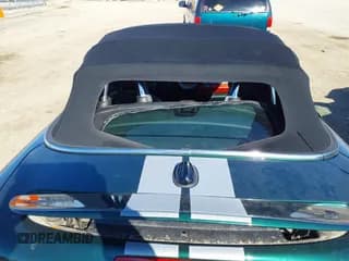 ✅ 2012 MINI Roadster S • VIN: WMWSY3C59CT144205 • Lot: 41675704. Listed on IAAI with 79,636 mi. Free auction sales archive from the USA and detailed vehicle history report at DreamBid. Image 6.