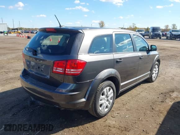 2015 Dodge Journey American Value z VIN 3C4PDCAB1FT637818, wystawiony jako IAAI lot #43497822 z przebiegiem 164 458 mil mil oraz . Historia ofert i sprzedaży dostępna na DreamBid. Obrazek 4.