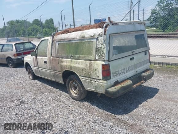 ✅ 1992 Isuzu Pickup S • VIN: 4S1CL11L3N4207154 • Lot: 42470949. Wystawiony na IAAI z przebiegiem 309 488 mil. Bezpłatny archiwum sprzedaży aukcyjnych z USA i szczegółowy raport historii pojazdu na DreamBid. Zdjęcie 3.