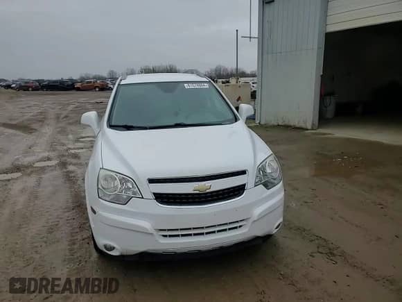 2014 Chevrolet Captiva Sport LT z VIN 3GNAL3EK5ES676247, wystawiony jako Copart lot #81578864 z przebiegiem 132 762 mil mil oraz Czysty tytuł • Clean title. Historia ofert i sprzedaży dostępna na DreamBid. Obrazek 14.
