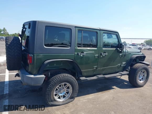 ✅ 2007 Jeep Wrangler Unlimited Sahara • VIN: 1J4GA59157L198095 • Lot: 43011519. Listed on IAAI with 198,022 mi. Free auction sales archive from the USA and detailed vehicle history report at DreamBid. Image 13.