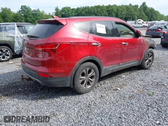 ✅ 2015 Hyundai Santa Fe • VIN: 5XYZUDLB4FG294425 • Lot: 42642628. Listed on IAAI with 89,000 mi. Free auction sales archive from the USA and detailed vehicle history report at DreamBid. Image 4.
