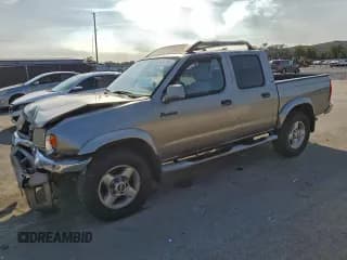 ✅ 2000 Nissan Frontier XE • VIN: 1N6ED27T6YC409553 • Lot: 94641915. Listed on Copart with 216,835 mi. Free auction sales archive from the USA and detailed vehicle history report at DreamBid. Image 1.