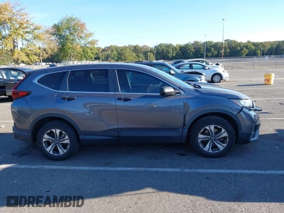 ✅ 2020 Honda CR-V LX • VIN: 2HKRW2H20LH608275 • Lot: 43361281. Listed on IAAI with 124,491 mi. Free auction sales archive from the USA and detailed vehicle history report at DreamBid. Image 13.