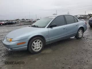 2002 Saturn SL с VIN 1G8ZK52772Z290447, выставлен на аукционе Copart как лот 68545105 с пробегом 183 346 миль миль и Списание • Salvage title. История ставок и продаж доступна на DreamBid. Изображение 1.
