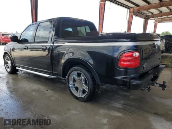 ✅ 2003 Ford F-150 Harley-Davidson • VIN: 1FTRW07383KD63595 • Lot: 59922725. Listed on Copart with 130,837 mi. Free auction sales archive from the USA and detailed vehicle history report at DreamBid. Image 2.