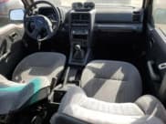 ✅ 1995 Suzuki Sidekick JS • VIN: 2S3TE02V1S6406369 • Lot: 67108335. Listed on Copart with 114,976 mi. Free auction sales archive from the USA and detailed vehicle history report at DreamBid. Image 8.