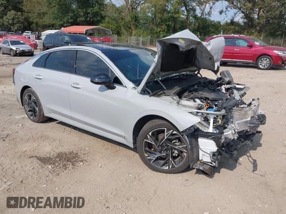 ✅ 2025 Kia K5 GT-Line • VIN: KNAG64J78S5288076 • Lot: 43233755. Listed on IAAI with 21,426 mi. Free auction sales archive from the USA and detailed vehicle history report at DreamBid. Image 1.