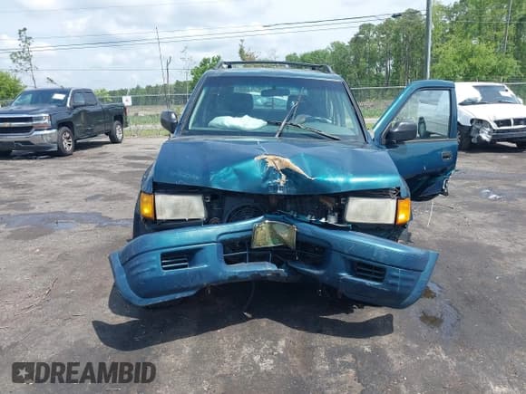✅ 1999 Isuzu Rodeo S • VIN: 4S2CK58W6X4332027 • Lot: 42087396. Listed on IAAI with 258,508 mi. Free auction sales archive from the USA and detailed vehicle history report at DreamBid. Image 11.