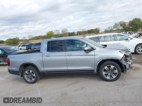 ✅ 2017 Honda Ridgeline RTL-T • VIN: 5FPYK3F60HB018044 • Lot: 43374137. Listed on IAAI with 115,043 mi. Free auction sales archive from the USA and detailed vehicle history report at DreamBid. Image 14.