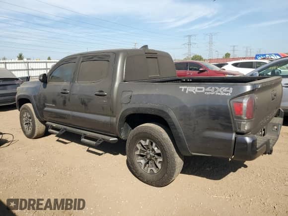 2022 Toyota Tacoma SR with VIN 3TMCZ5AN8NM462658, listed as a Copart auction lot 85084125 with 58,321 mi miles and Salvage title. Bid and sale history available at DreamBid. Image 2.