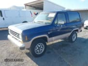✅ 1987 Ford Bronco • VIN: 1FMCU14T6HUB39707 • Lot: 43177737. Wystawiony na IAAI z przebiegiem 16 444 mil. Bezpłatny archiwum sprzedaży aukcyjnych z USA i szczegółowy raport historii pojazdu na DreamBid. Zdjęcie 2.