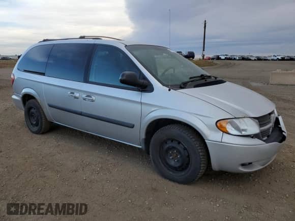 2006 Dodge Grand Caravan SE with VIN 1D4GP24R66B697589, listed as a Copart auction lot 90105685 with 303,817 mi miles and Salvage title. Bid and sale history available at DreamBid. Image 4.