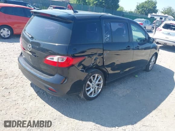 ✅ 2012 Mazda 5 Touring • VIN: JM1CW2CL5C0111869 • Lot: 42581945. Listed on IAAI with 98,909 mi. Free auction sales archive from the USA and detailed vehicle history report at DreamBid. Image 4.