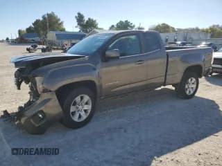 ✅ 2015 GMC Canyon 2WD SLE • VIN: 1GTH5BEA7F1144066 • Lot: 90898695. Listed on Copart with 111,679 mi. Free auction sales archive from the USA and detailed vehicle history report at DreamBid. Image 1.