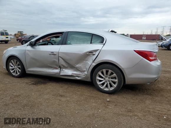 ✅ 2015 Buick LaCrosse Leather • VIN: 1G4GB5G38FF272464 • Лот: 86590435. Опубликован ранее на Copart с пробегом 164 365 миль. Бесплатный доступ к архиву аукционных продаж из США и подробный отчёт об истории автомобиля на DreamBid. Изображение 2.