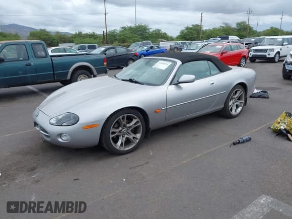 ✅ 2003 Jaguar XK • VIN: SAJDA42C232A34869 • Lot: 42058494. Listed on IAAI with 33,868 mi. Free auction sales archive from the USA and detailed vehicle history report at DreamBid. Image 2.