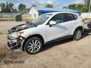 ✅ 2015 Mazda CX-5 Grand Touring • VIN: JM3KE2DYXF0548156 • Lot: 64492935. Wystawiony na Copart z przebiegiem 195 926 mil. Bezpłatny archiwum sprzedaży aukcyjnych z USA i szczegółowy raport historii pojazdu na DreamBid. Zdjęcie 1.
