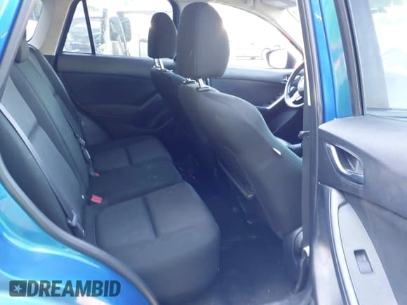 ✅ 2014 Mazda CX-5 Sport • VIN: JM3KE2BE7E0332563 • Lot: 42770891. Listed on IAAI with 145,924 mi. Free auction sales archive from the USA and detailed vehicle history report at DreamBid. Image 8.